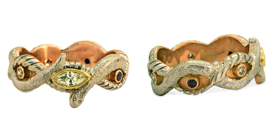 This custom snake ring, made at a customer's request, is just one example of our capacity as custom jewelers! This custom ring features diamond and sapphire.